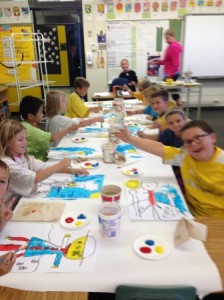 2nd grade mixing their primary colors.
