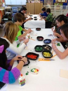 6th grade working on their stain glass mosaics.