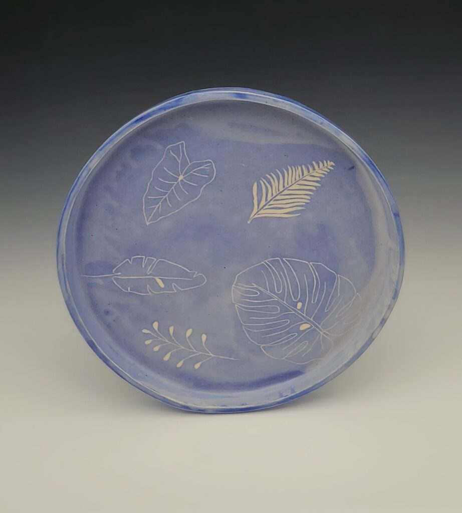 blue plate with leaves