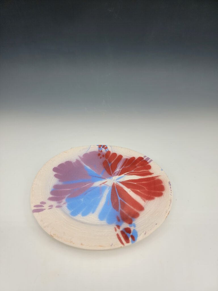 disc with multicolored flower