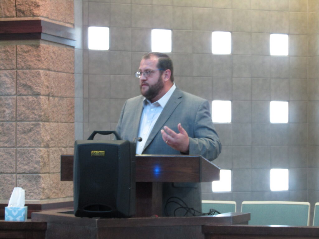 Brett Peterson speaking at graduation