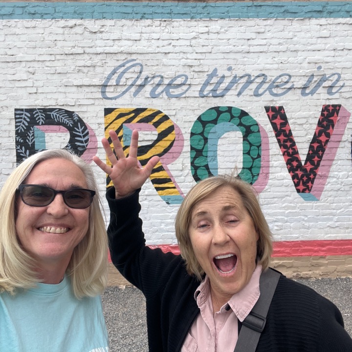 Brenda and Jodie in front of the Provo sign