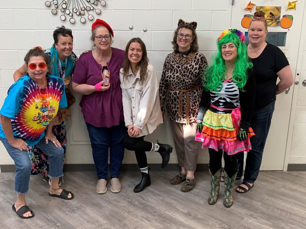 Teachers and Staff dressed up in costumes for Halloween.