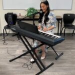 Miss Utah 2023 playing keyboard.