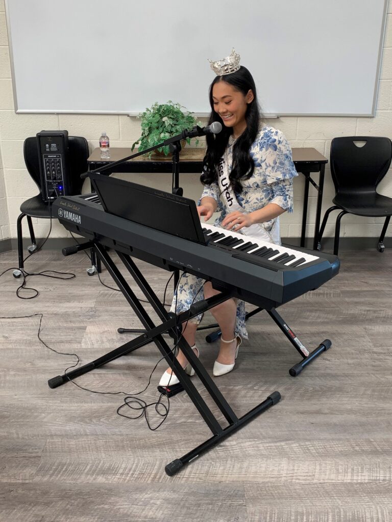 Miss Utah 2023 playing keyboard.