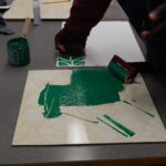 Student stamping paper